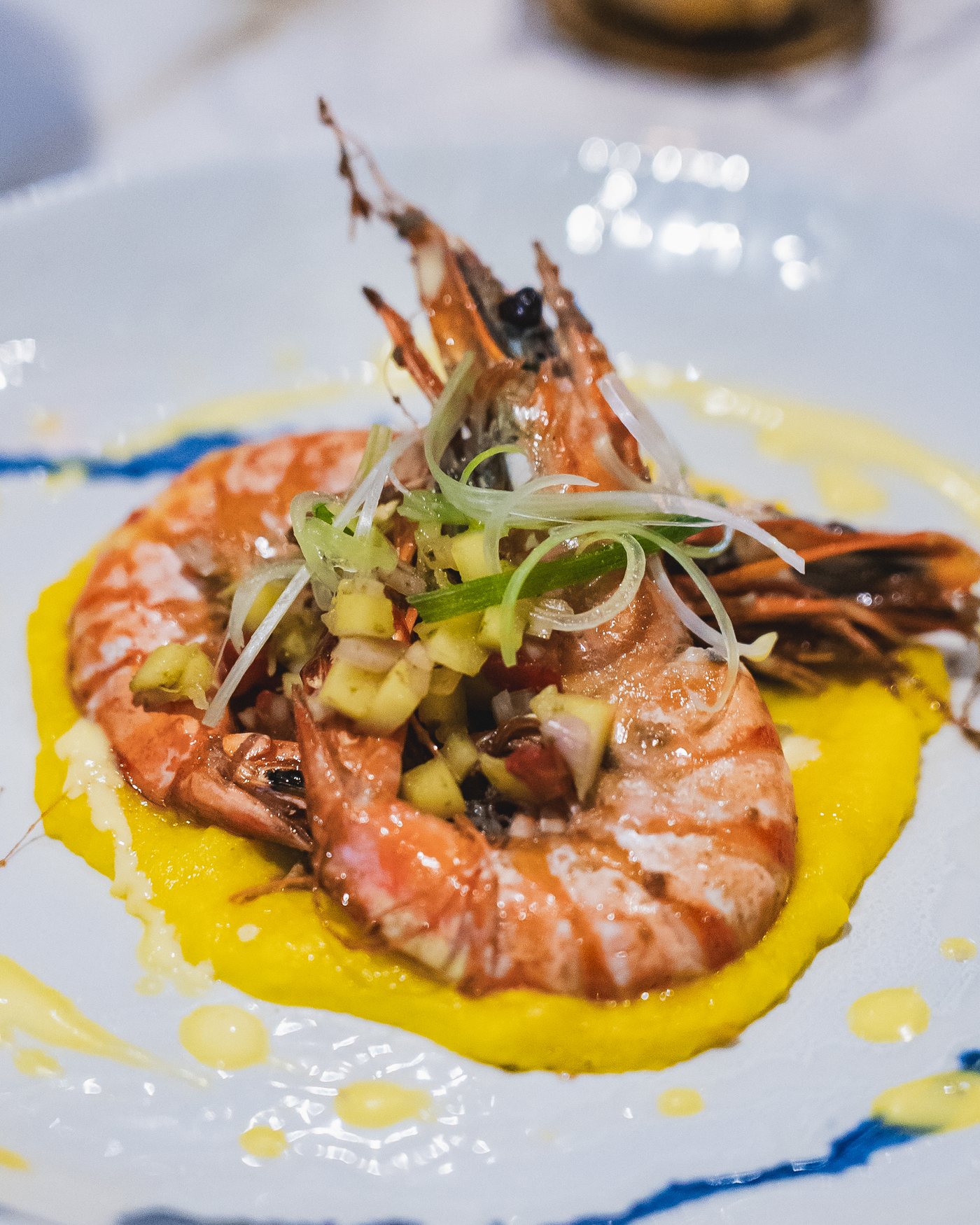 King prawns on a saffron cream with a mango and pepper salsa