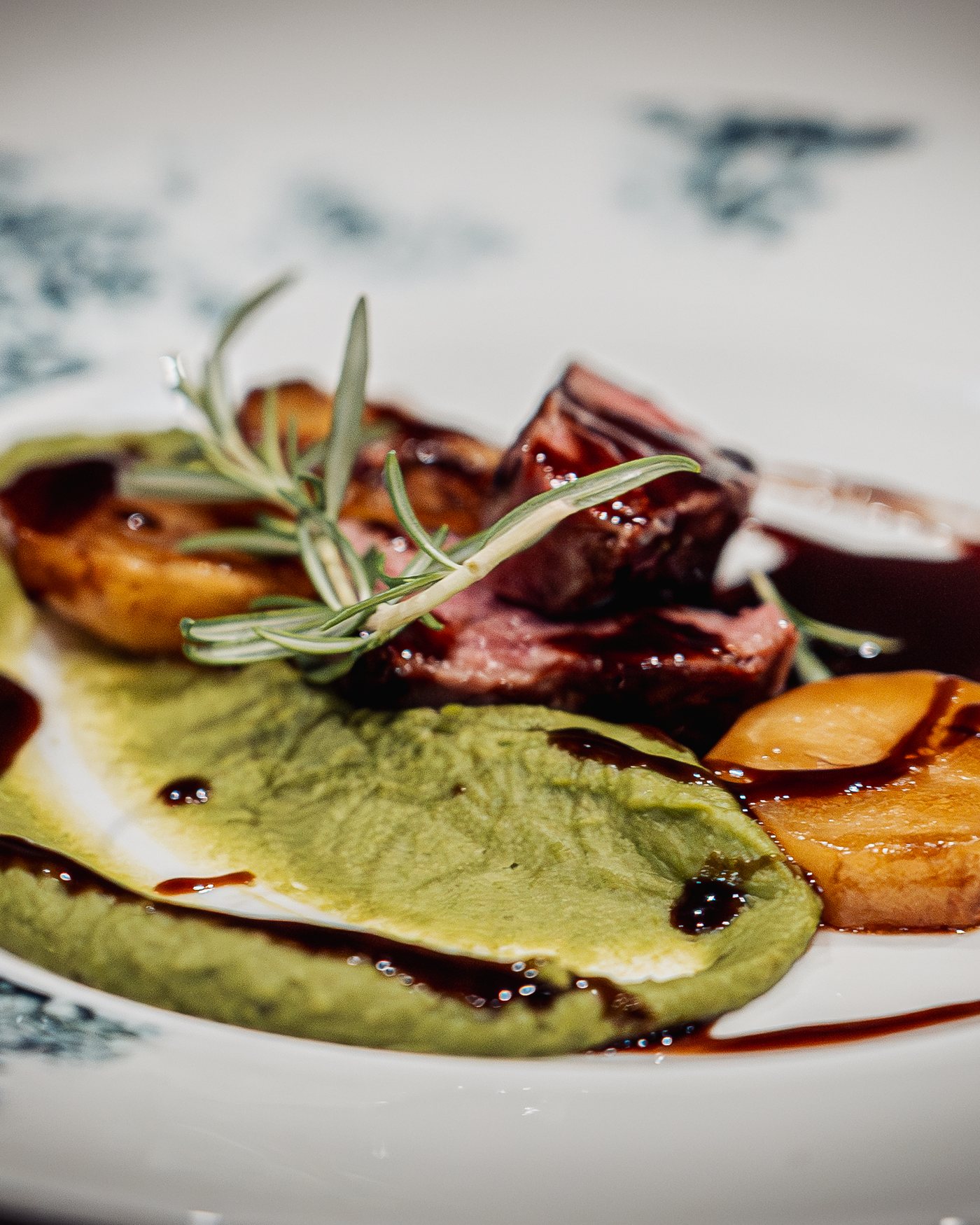 Spring lamb with rosemary jus, pea purée and fondant potato, from a past tasting menu