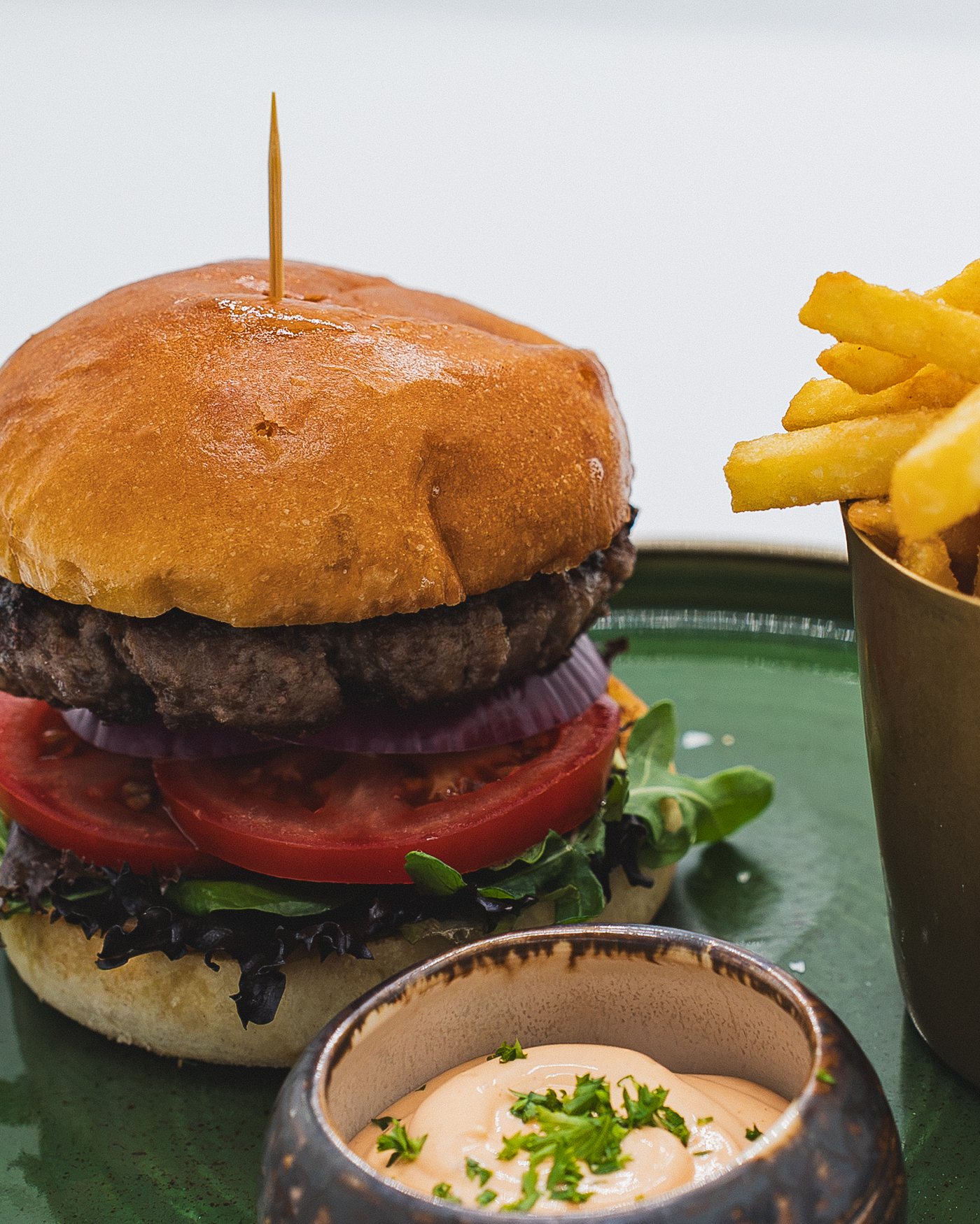 Close view of the Wagyu beef burger with fries