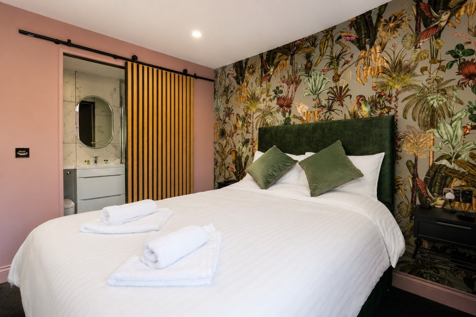 The pink botanical room with its own en-suite bathroom through a sliding oak door